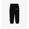 Joggingbyxor i bomull med kursivt logotypmönster Joggingbyxor i bomull med kursivt logotypmönster
