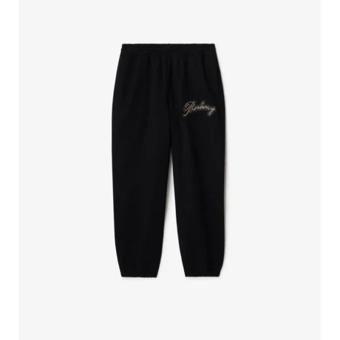 Joggingbyxor i bomull med kursivt logotypmönster Joggingbyxor i bomull med kursivt logotypmönster