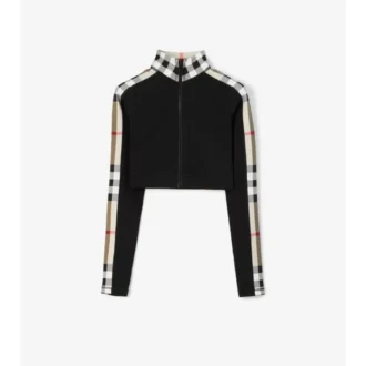 Kort topp i stretchjersey med rutmönster och dragkedja Kort topp i stretchjersey med rutmönster och dragkedja